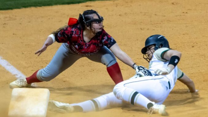 Hoke County softball makes a play to get the runner out at third base during the Bucks’ win over Pinecrest (David Sinclair/NSJ)