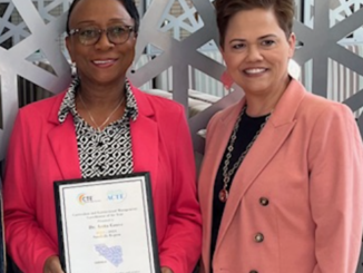 Dr. Anita Grove (left) stands with Dr. Dana Chavis (right) - from Hoke County Schools