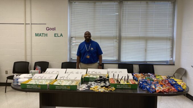 Antonio Covington poses before a Boss’s Day luncheon while serving as principal of East Hoke Middle School last year. Covington will take on a new role, as athletic director for Hoke County High School, on July 1. (Covington’s Twitter/X account)