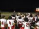 Hoke County’s football team huddles up for instructions during last Friday’s Cumberland County Jamboree. (Hal Nunn for North State Journal)