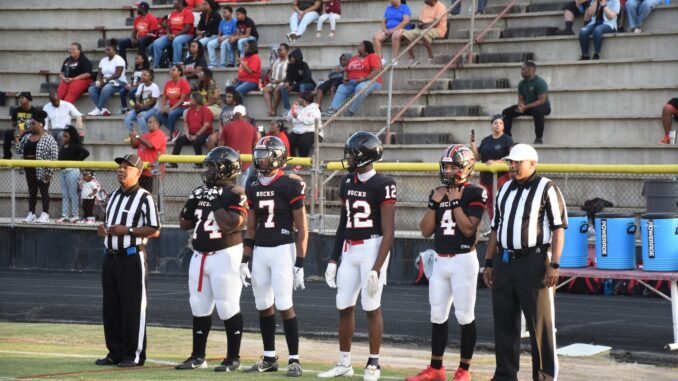 Hoke County’s captains for the opening game, (L to R) Tafari Parker, Josh Ferrell, Franajai Ransom, Brandon Saunders, get ready for the coin toss. (Hal Nunn for the North State Journal)