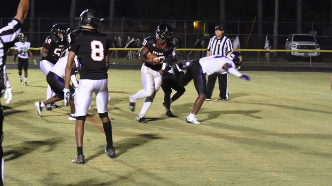 Favor Anab (20) gets around a defender and crosses the goal line for a two-point conversion in Hoke County’s season opening game. Anab also added a rushing touchdown, but the Bucks fell by five points to Jack Britt, 27-22. (Hal Nunn for North State Journal)