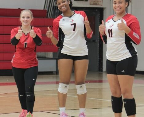 It’s been all thumbs up this season for (L to R) Aubrey Carpenter, Abigail Watts and Chayna Locklear and the rest of Hoke County’s volleyball team.