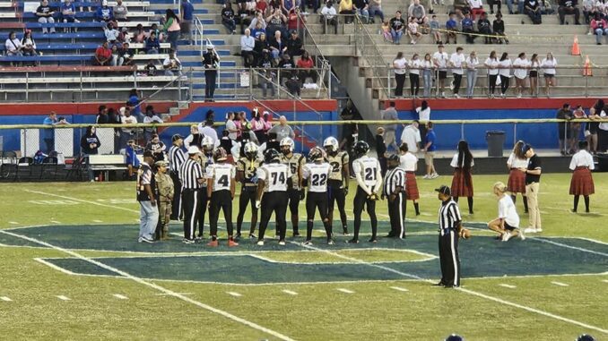 Hoke’s team captains meet their counterparts with Scotland for the pregame coin toss. The Bucks led a back-and-forth game into the fourth quarter but came up short on the road against the Scots. (Hal Nunn for North State Journal)